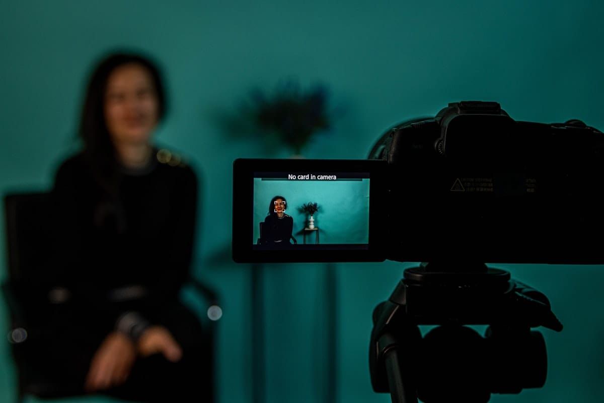 Camera LCD screen showing a person being recorded for a video interview