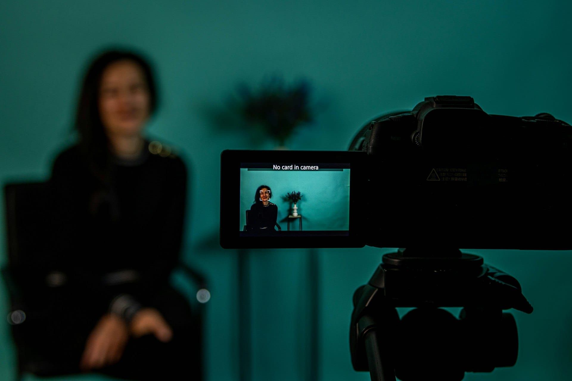 Woman being recorded on camera for a video testimonial