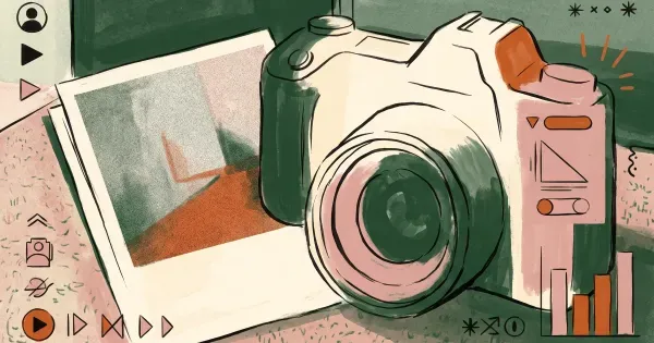 Mirrorless camera resting beside a printed photograph with visible grain and noise texture, no dials or text visible