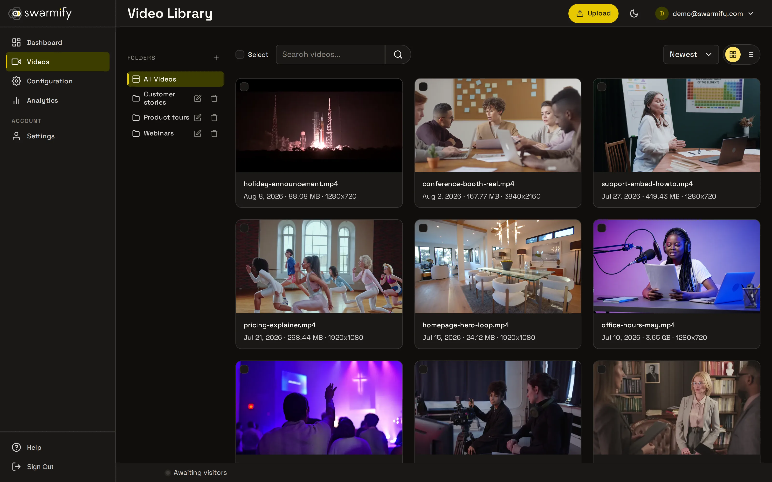 SmartVideo dashboard — video library with folders and upload, dark theme